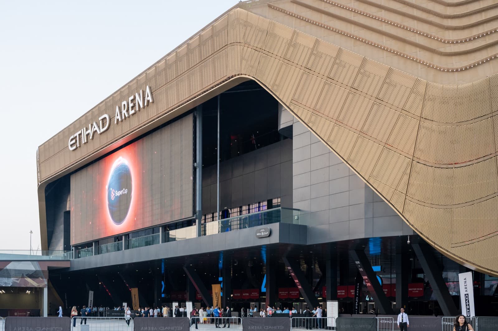 The bronze-ribbed facade of Etihad Arena on Yas Bay